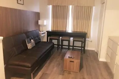 a living room with a couch and a piano at Universal-Disney Dream 606H Studio - The Point in Orlando