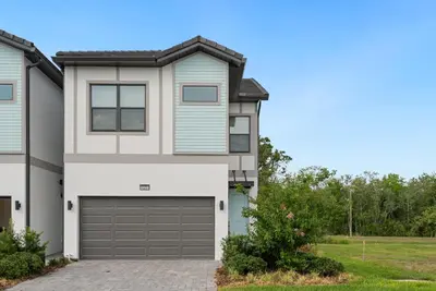 a house with a garage at 10251 EBB Tide Lane in Orlando