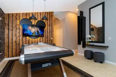 a room with a ping pong table in it at 4 Bedroom with Pool near to Disney in Kissimmee