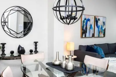 a living room with a glass table and a couch at Emerald Island Resort townhouse 3 Bedrooms in Kissimmee