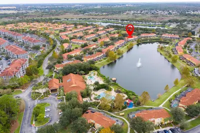 a hot air balloon flying over a lake at 3 Bedrooms Home W Pool just 6 miles from Disney in Kissimmee