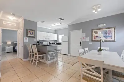 a kitchen and dining room with a table and chairs at Perfect Gateway to Disney 9108 in Kissimmee