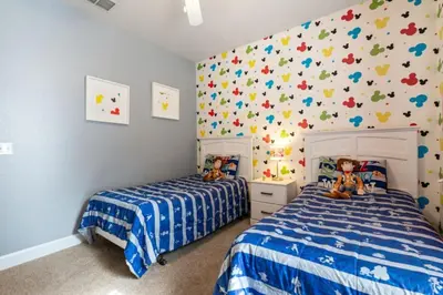 a bedroom with two beds and a wall covered in bugs at Perfect Gateway to Disney 9108 in Kissimmee
