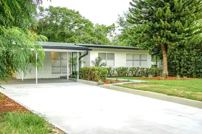 a house with a driveway in front of it at Exquisite Luxury Villa with Pool in Prime Location in Orlando