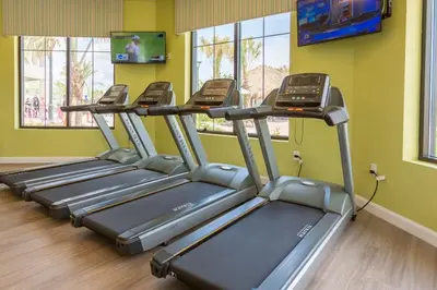 a row of treadmills in a gym at Your 4BDR Vacation Home - 4838 in Kissimmee