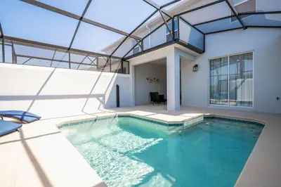 an indoor swimming pool with a glass ceiling at Magical Stay Mickey and Harry Potter Rooms in Kissimmee