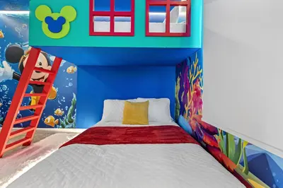 a bedroom with a bed with a fish themed wall at New Home 04 Bedrooms At Storey Lake in Kissimmee