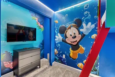 a childs room with a mickey under the sea mural at New Home 04 Bedrooms At Storey Lake in Kissimmee