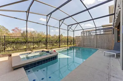 an indoor swimming pool with a glass roof at 2817 Storey Lake Kissimmee in Kissimmee