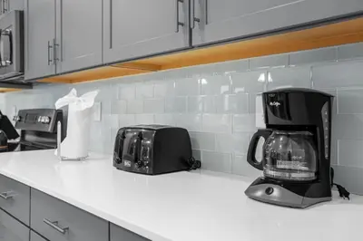 a kitchen counter with two toasters and a toaster at Disney Vacation Villa Pool & BBQ & Resort Clubhouse in Kissimmee