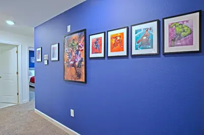 a blue wall with a bunch of pictures on it at 4213 - Lakeside Retreat in Kissimmee