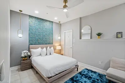 a bedroom with a white bed and a couch at 14531 Damai in Orlando