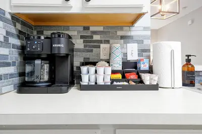 a kitchen counter with a coffeemaker and a coffee maker at Spring Break Awaits Disney Close Pool Slides Fun in Orlando