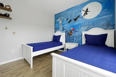 a bedroom with two beds and a disney mural at Spring Break Awaits Disney Close Pool Slides Fun in Orlando