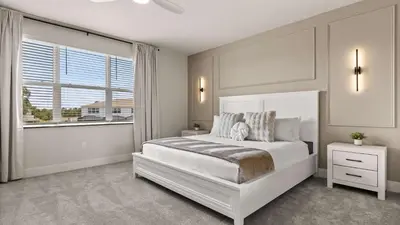 a white bedroom with a large bed and a window at Upstay-Luxury 3BR Home w Private Pool & Games Room in Orlando