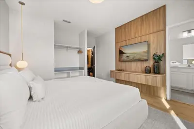 a white bedroom with a large bed and a sink at 15 Bedrooms 165 Bathrooms Sonoma 4081 Sb in Kissimmee