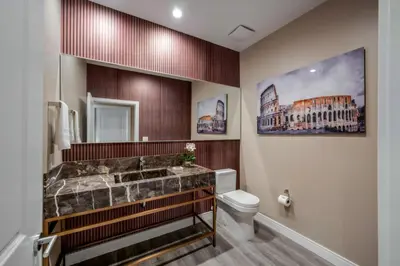 a bathroom with a tub and a toilet at Luxury Family Townhouse Near Disney & Dining in Kissimmee