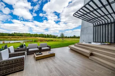 a living room with a view of a field at Luxury Family Townhouse Near Disney & Dining in Kissimmee
