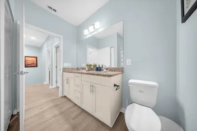 a bathroom with a toilet and a sink at 3204 GL - Serene Lucaya Oasis Retreat in Kissimmee