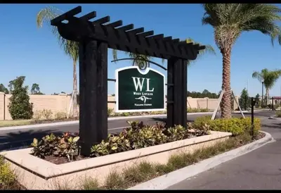 a sign for a wii resort with palm trees at 3204 GL - Serene Lucaya Oasis Retreat in Kissimmee