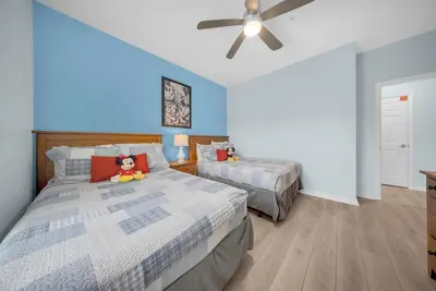 a bedroom with two beds and a ceiling fan at 3204 GL - Serene Lucaya Oasis Retreat in Kissimmee