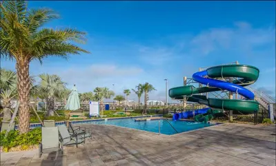 a water slide in a resort with a pool at 2 Bedrooms Apartment in Storey Lake in Kissimmee