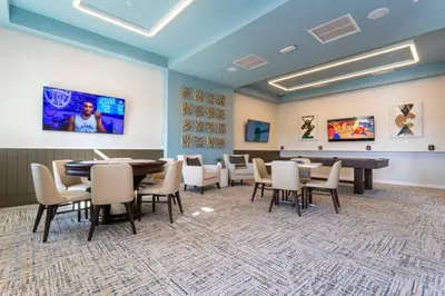 a conference room with a table and chairs in it at Stylish Home & Free Resort Access 2420 in Kissimmee