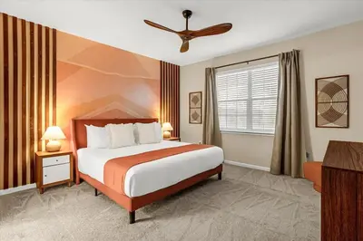 a hotel room with a bed and a window at Upstay Bella Vida Resort - Resort-Style 12BR Villa in Kissimmee