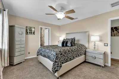 a bedroom with a bed and a ceiling fan at AF2574 - Windsor Hills Resort Vacation Home in Orlando