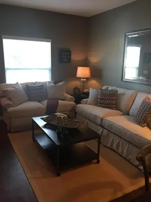 a living room with two couches and a coffee table at 3BR Townhome West Lucaya Resort Close to Disney in Kissimmee