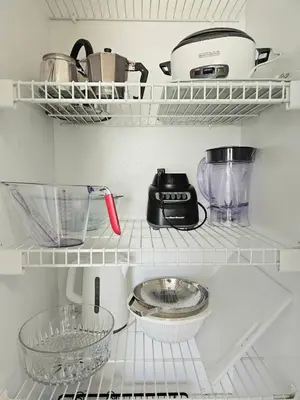 a kitchen shelf with a blender and other kitchen items at Beauty 4 miles to Disney 3Br 2Ba Pool Home in Kissimmee