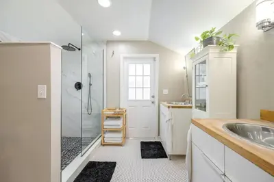 a bathroom with a shower and a sink at Massive 3 bedroom with large backyard in Orlando