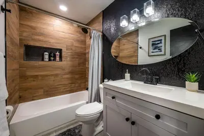 a bathroom with a sink and a tub and a toilet at Large 2 bedroom with King bed and Patio in Orlando