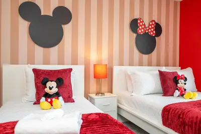two beds with stuffed animals sitting on them in a bedroom at Beautiful 4 BR close to Disney in Kissimmee