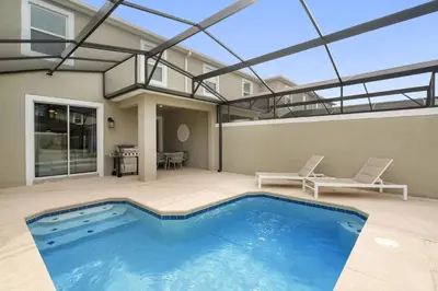 a swimming pool in a house with a glass ceiling at Refúgio Incrível a 10 Min da Disney – Storey Lake in Kissimmee
