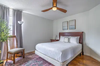 a bedroom with a bed and a ceiling fan at 8512 Emerald Island in Kissimmee