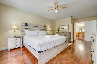 a bedroom with a bed and a ceiling fan at Sun Kissed Pool Home in Kissimmee in Kissimmee