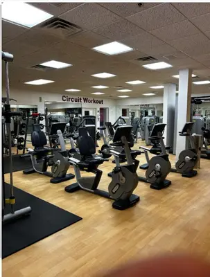 a gym with a lot of treadmills and ellipticals at Westgate Towers in Orlando