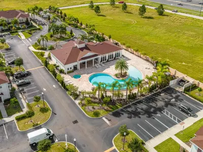 an aerial view of a parking lot at a resort at Amzing location 3BDR House - 8980 in Kissimmee