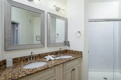 a bathroom with two sinks and a shower at 4862 Cayview Avenue 408 in Orlando