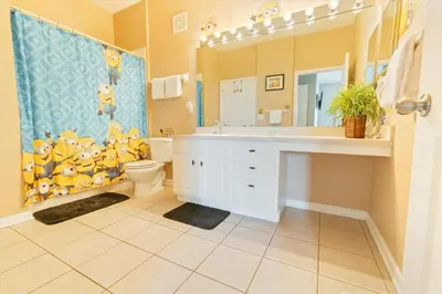 a bathroom with a sink and a toilet and a mirror at 2784 Almaton 404 in Orlando