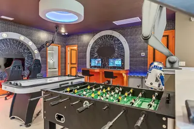 a game room with a foos ball and a table at Brand NEW 11 Bedrooms At Sonoma in Kissimmee