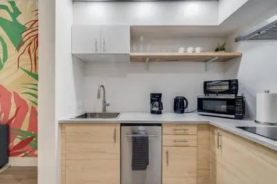 a kitchen with a sink and a microwave at Brand new - near Epic Universe & Universal Studios in Orlando