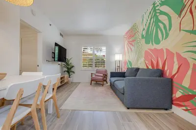 a living room with a couch and a table at Brand new - near Epic Universe & Universal Studios in Orlando