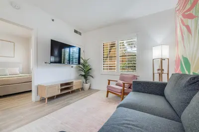 a living room with a couch and a tv at Brand new - near Epic Universe & Universal Studios in Orlando