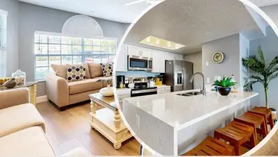 a kitchen and living room with a white counter top at The Palms 1st floor By Pool, Fully Stocked 5 stars in Kissimmee