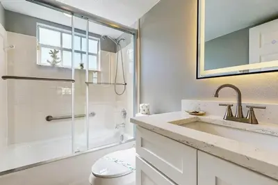 a bathroom with a toilet and a sink and a shower at The Palms 1st floor By Pool, Fully Stocked 5 stars in Kissimmee