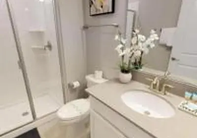 a bathroom with a sink and a toilet and a shower at 4826 LL - Storey Lake Dream 4BR Pool Home Near Disney in Kissimmee