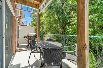 a patio with a table and chairs on a porch at Cozy Kissimmee Hideaway in Kissimmee