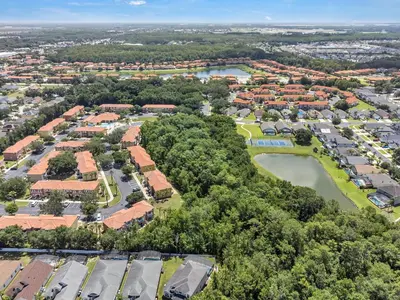an aerial view of a community of houses and trees at Cozy Kissimmee Hideaway in Kissimmee